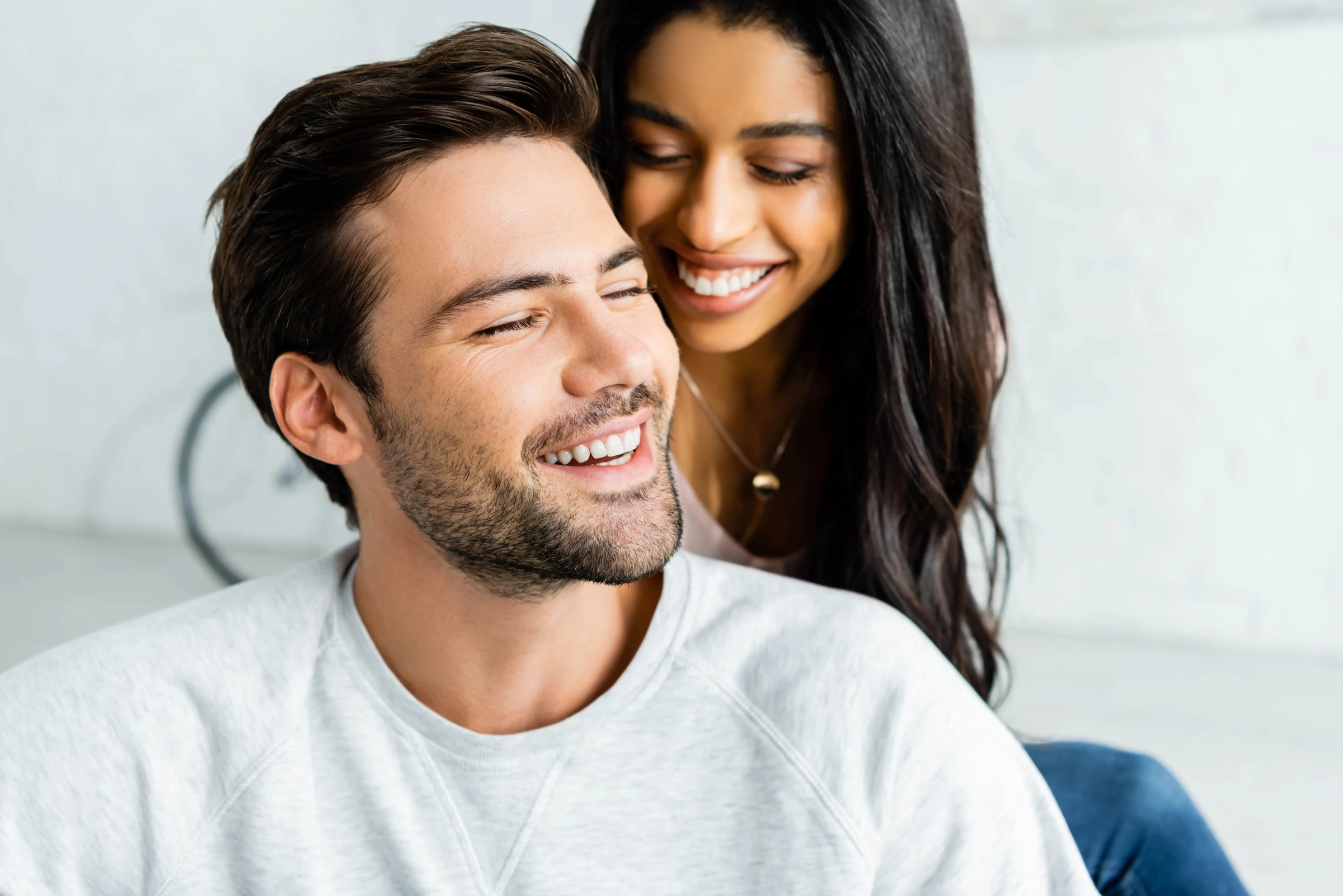 Couple smiling close together